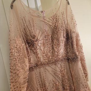 This is a customized gorgeous size 14 dress that was only worn once!